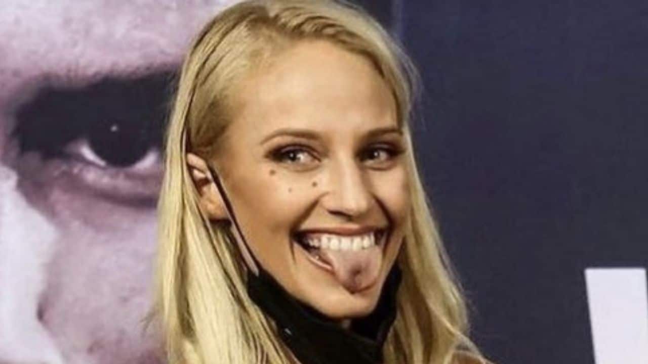 “They want to fall out of my dress,” Ebanie Bridges comments as her b**bs spill out of her dress as she poses with Conor McGregor